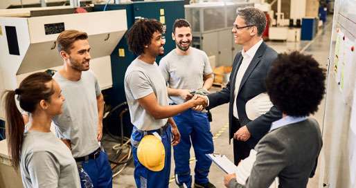 Insudtrial workers meeting with their manager